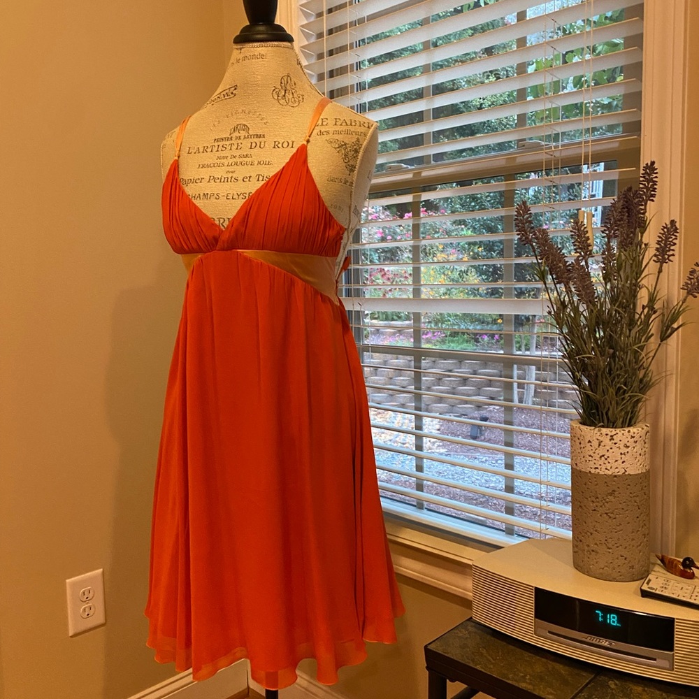 Beautiful Bebe dress in bright orange color